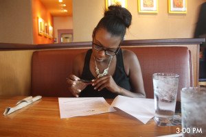 Tasha signing contracts