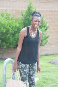 Tasha smiling in wrist soiree, silence + noise shirt and naomi rose jeans