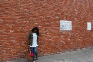 Tasha outside with army jacket and leopard flats. | Imperfect Concepts